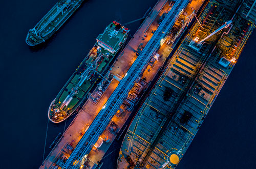 Aerial view of commercial boats moored in port - Vision Marine